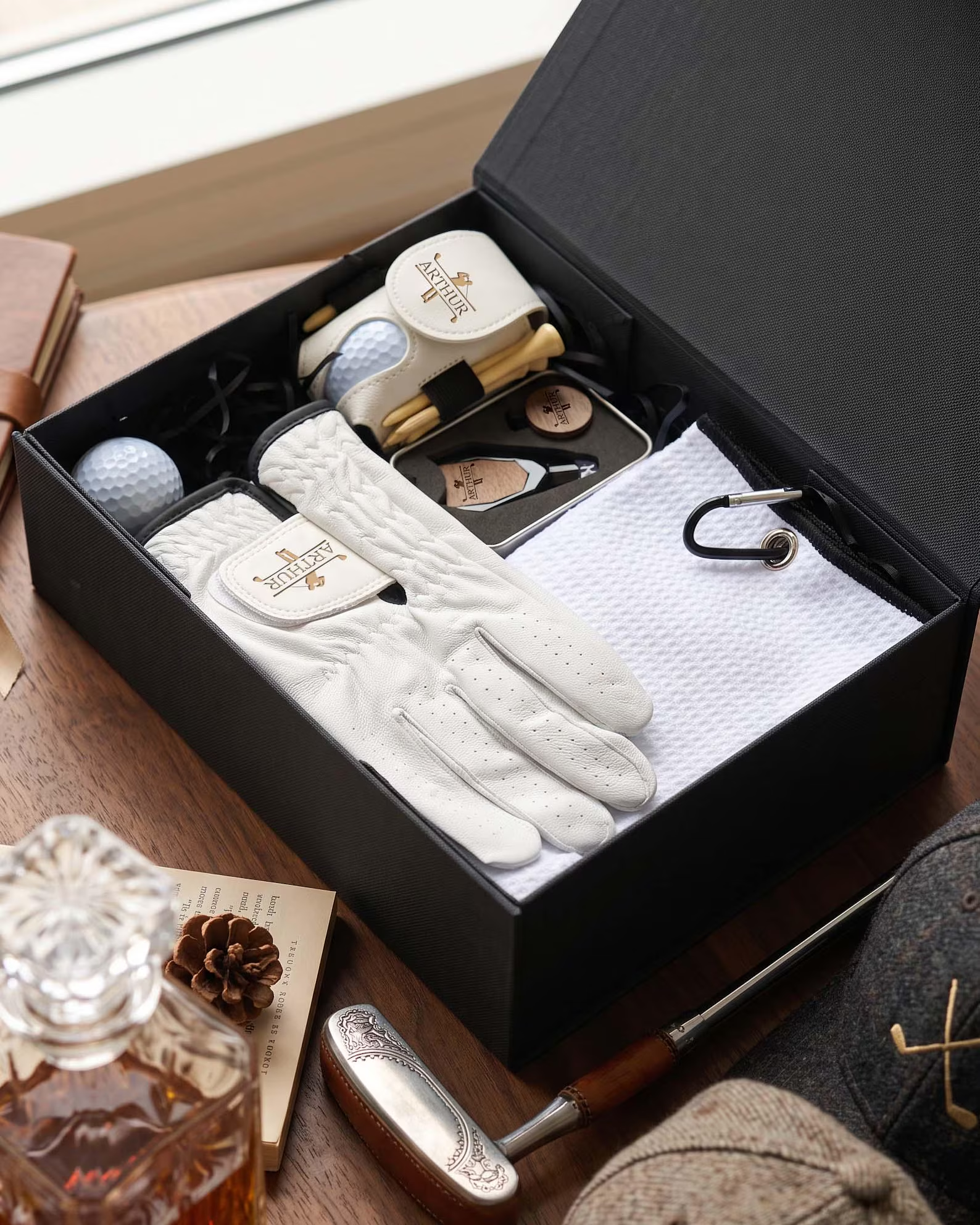 Golf gift box with a glove, towel, golf balls and accessories