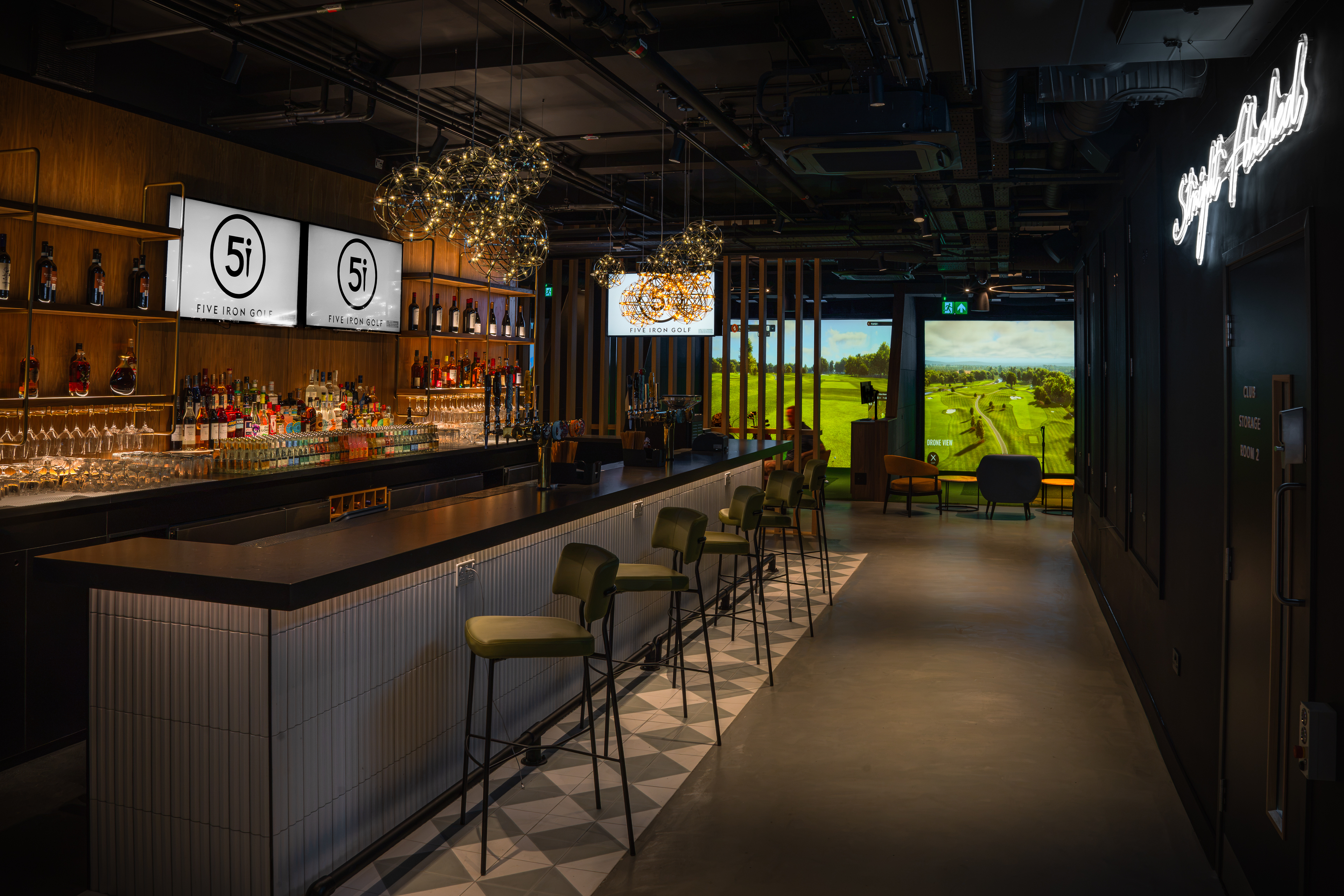Five Iron Golf London, with a bar and indoor golf bays